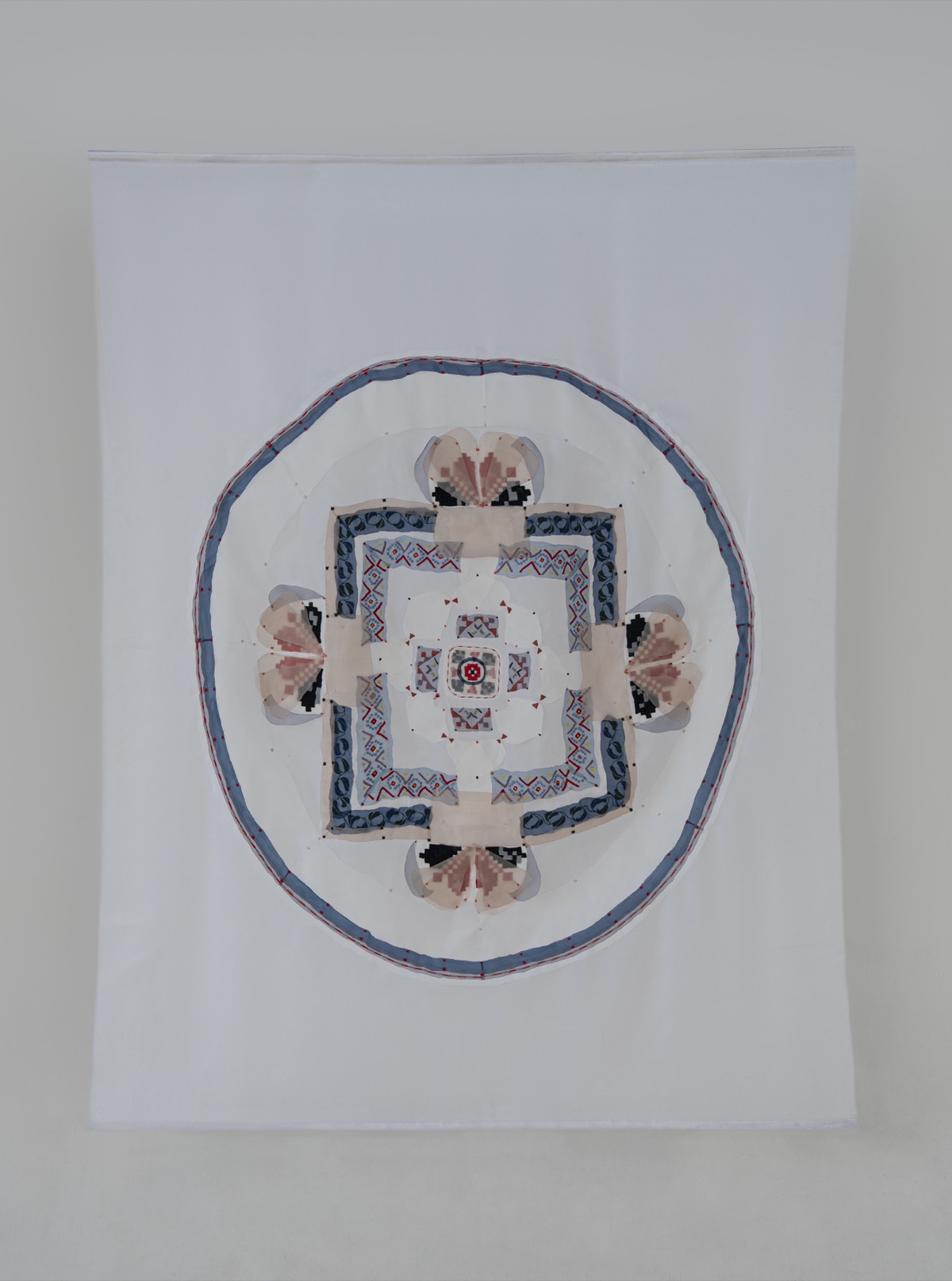 The Tibetan Mandala in Ukrainian Thread — white organza hanging with circular mandala composition